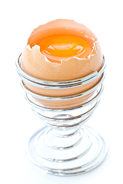 15882792 - egg yolk in the shell on a white background